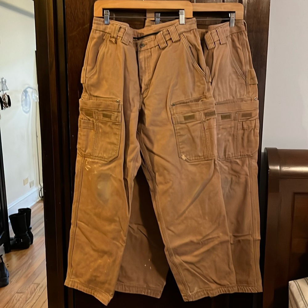 Two pairs men’s 100% cotton Duluth Trader Fire Hose Cargo Pants - brown/tan
